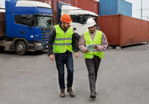 full-shot-men-wearing-helmets-vests